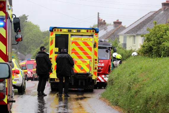 Emergency services and two armed police officers at the scene of the incident at Black Dog. AQ 1433