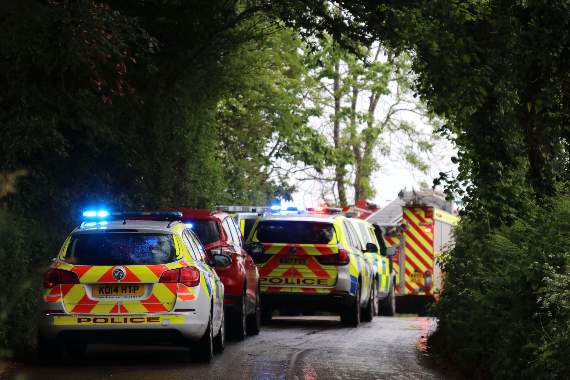 Some of the emergency services vehicles on roads into Black Dog. AQ 1428