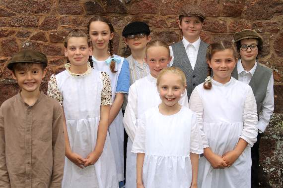 Some of the young performers in ‘The Men Who Marched Away, Kirton 1914-19’ before they took to the stage in Crediton Parish Church. AQ 2168