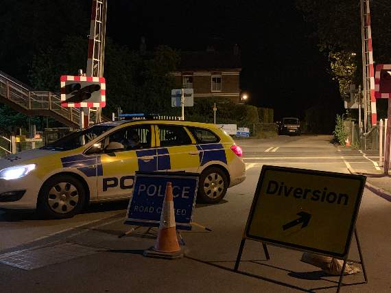 The road closure in place at the Fordton rail crossing at Crediton Railway Station. AQ 7768