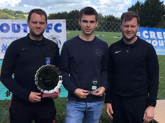 Rob Stoyle receiving the James Uren Award for Young Referee from Dan and Matt Uren.