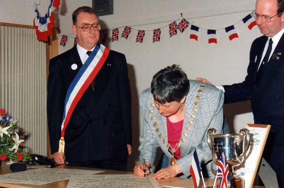 During the Charter signing in May 1993 by Fran Richer, watched by Andre Basin and Peter Brewer, right.