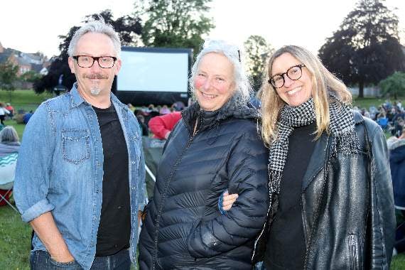 Visitors ready for the film to start in Newcombes Meadow. AQ 1851