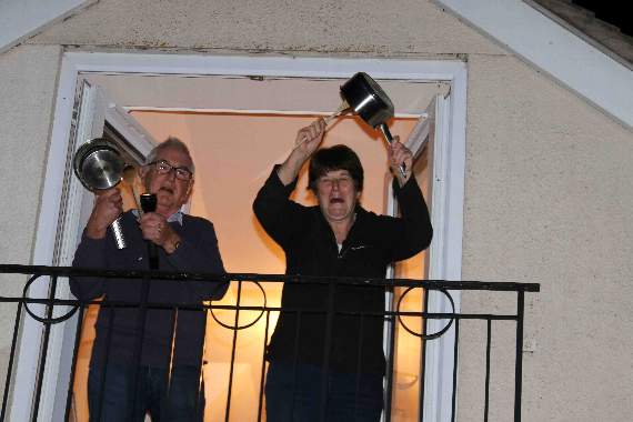 George Hill neighbours on their balcony thanking NHS staff. AQ 7208