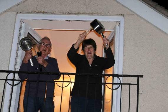 George Hill neighbours on their balcony thanking NHS staff. AQ 7208