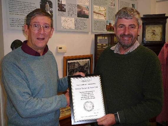 Jonathan Webber of Tuckers Country Store in Crediton received an award from John Heal.