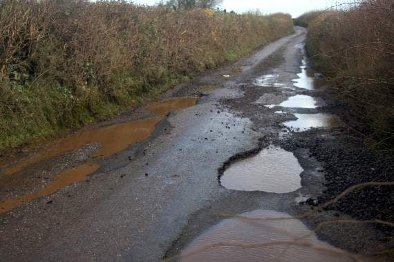 This is only a part of the stretch of road where the potholes have joined up. SR 2779