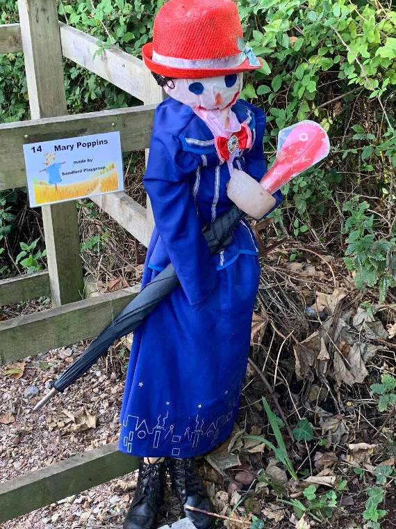 Mary Poppins, complete with umbrella and a pretty brooch, was created by members of Sandford Playgroup for the scarecrow trail.
