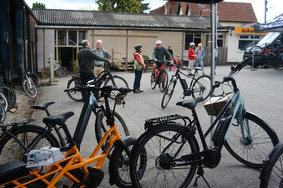 Looking across the forecourt at The Bike Shed on the Demo Day, the yellow bike at the front can carry a load, even an adult passenger or two children and its dual battery means it can do up to 155 miles at a time. SR 1436