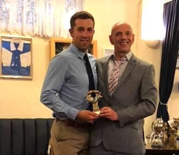 Dave Lee, left, First Team Supporters’ Player of the Year is presented with the cup by Chairman Martin Edgington.