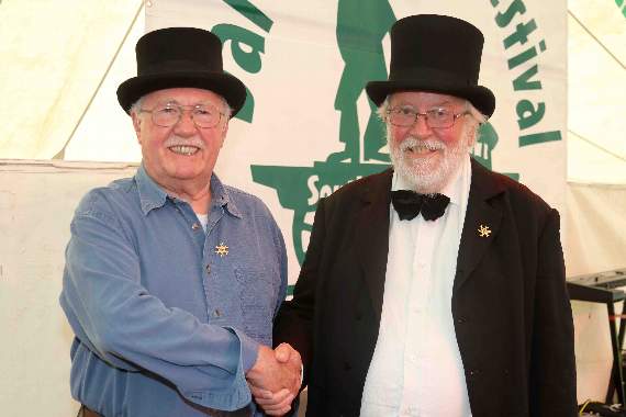Vic Legg, left, from Bodmin, was presented with an English Dance and Song Society gold badge for outstanding services to folk music, dance and song, from Eddie Upton.