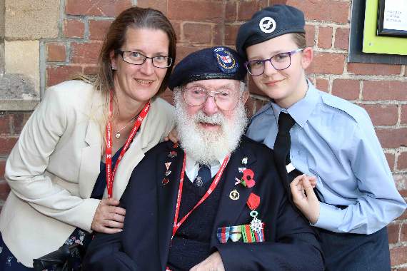 D-Day veteran Bob Reeves, with his granddaughter Kaye Vinnicombe, left and his great-granddaughter, Alisha Baker, right. AQ 1730