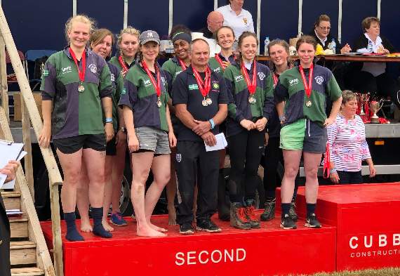 On the podium, Haldon ladies collecting their medals.