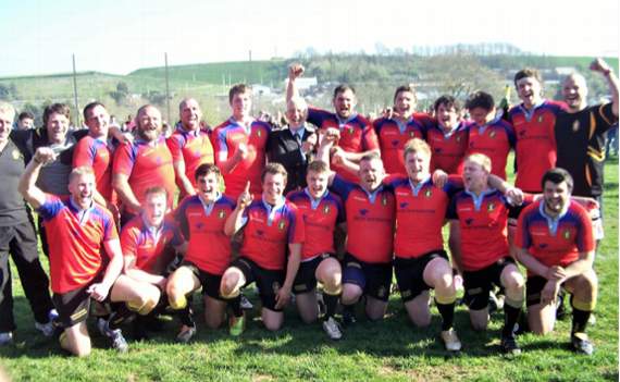 Crediton RFC 2014-15 team were the Cornwall and Devon Champions: Standing from left, Chris Lee (Coach), Chris Simpson, Chris Hooper, Wayne Reed, Dan Manns, Josh Lee, Roger Holloway (Chairman), Mark Nott (Capt), Leigh Kinch, Ben Wonnacott, Jake Clarke, Can Huxtable and Dave Kimberley (Coach); Kneeling; Gav Best, Devon Hosegood, Ollie Avery-Wright, Tom Ronchetti, Bobby Mogford, Mark Lee, Mike Pearce and Lance Palmer.