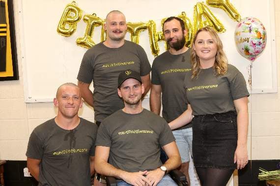 After their headshave and trims, standing from left, Sam Bullingham and Alex Dennis and front left, Matt Baker with Craig Dennis and right, Chloe Dennis. AQ 4304