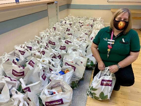 Sharon Arnold with some of the packed food parcels.
