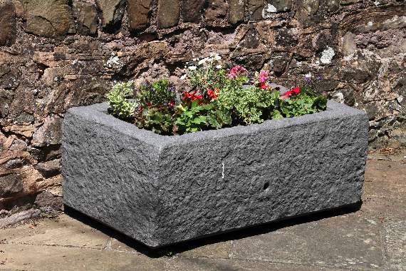 One of the new tubs beside Crediton Town and Hamlets War Memorial. AQ 1425