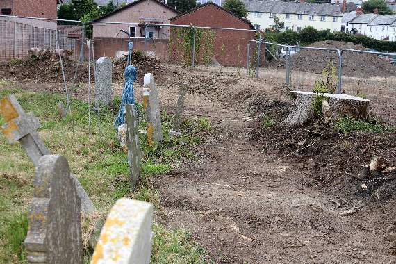 The north east corner of Lapford churchyard where earth was removed from the top of graves by a mechanical digger. AQ 8651