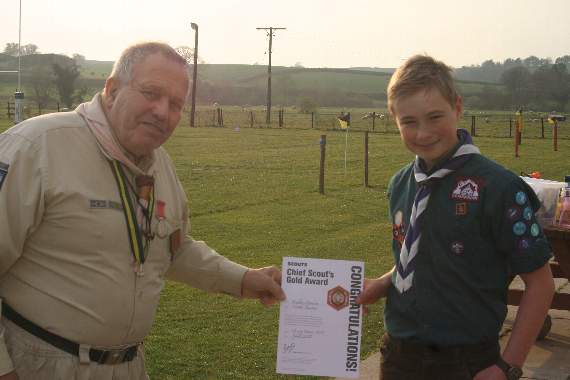 Scout Finlay Stanton received his Chief Scout Gold award from George Davey. 3546
