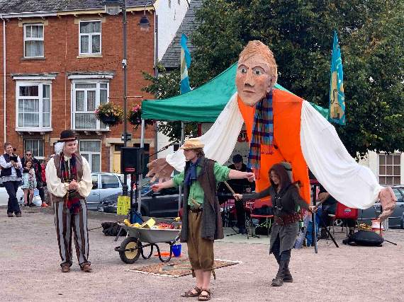 The giant and some of the cast of ‘Fearless Jack’ in Crediton’s Town Square.