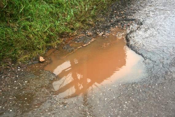 A rather good pothole at the side of the road from Copplestone into New Buildings. 3509