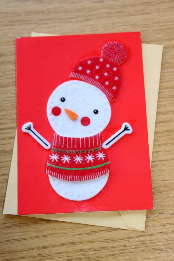 Frank Letch thought that this card depicting a snowman was reaching out to give everyone a hug. AQ 0053