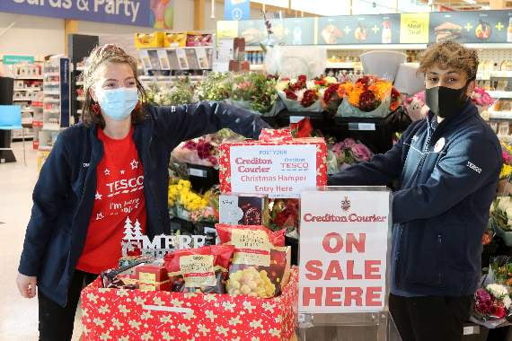 The winning ticket being drawn for the Christmas Hamper in the ‘Courier’ and Crediton Tesco competition. AQ 9898