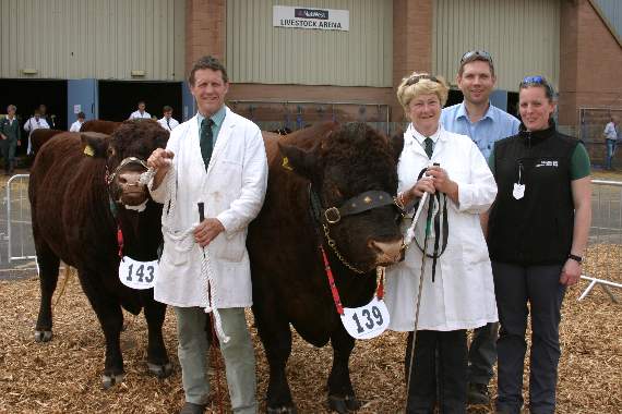 John and his wife Sue with their Devon cattle at the 2017 Devon County Show, pictured with staff from St Boniface Vets of Crediton. AQ 2334