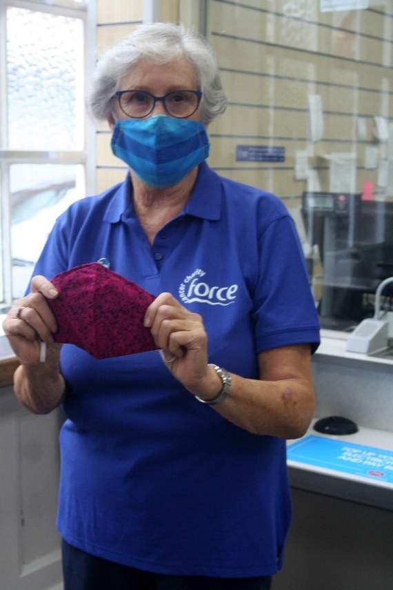 Ann Thomson holding one of the masks she makes in aid of FORCE. SR 3226
