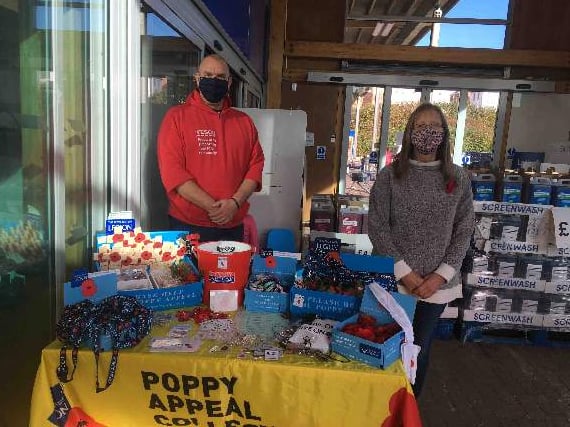 Andrew Drayton, Tesco Champion and Jane Sansom, Crediton Poppy Appeal Organiser after they set up the table.