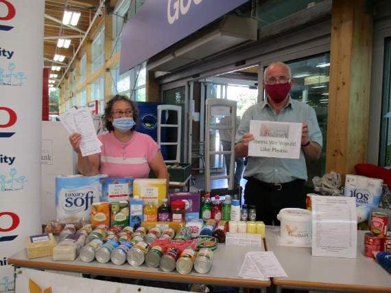 Foodbank volunteer Sandra Collier, with Julian, who was helping with the transporting of the goods to the Food Bank at the Congregational Church. Photo: Margaret Tucker