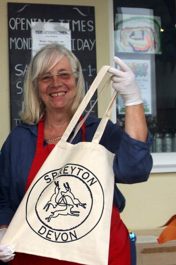 Holding the new bag launched that day is volunteer Kay Caldwell.