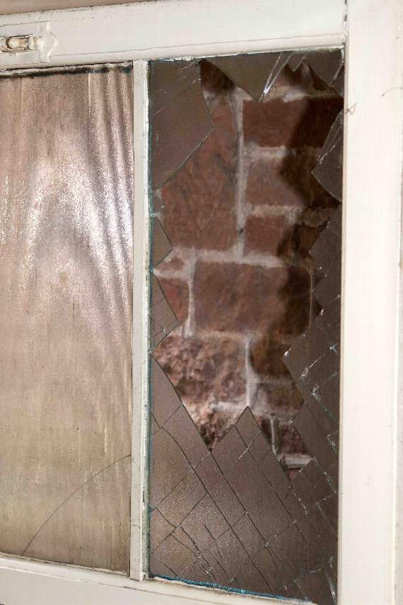 The smashed pane in the door at The Manse. AQ 8764