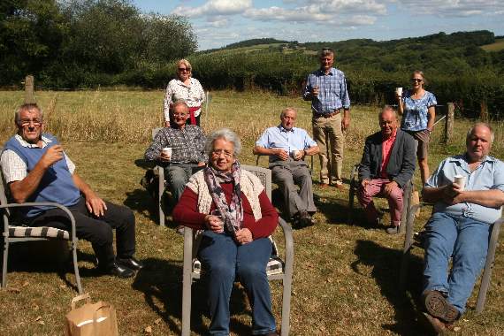 Renee Jarvis, seated centre, with parish councillors and Mid Devon District Council member Derek Coren in Renee’s garden. SR 3142