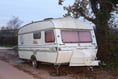 Do you know who fly-tipped a caravan full of rubbish near Crediton?