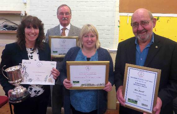 With their special certificates and Landscore headteacher Debbie May holding their cup are Mike Szabo (at back), Landscore’s Penny Powlesland, and Bert Jewell. SR 0539
