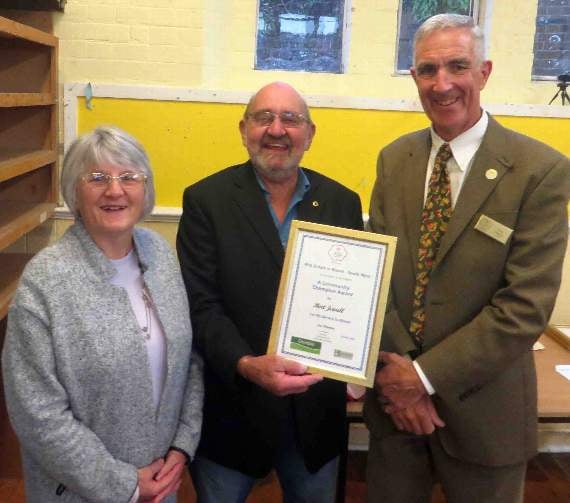 Bert and Margaret Jewell with their certificate and Tony Moore. SR 0528