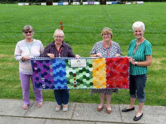 Needlewomen Jo Fear, Hilary Edwards, Maria Dilley and Sue Knott with the patchwork members made. SR 2003