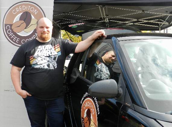 Cars and Coffee show organiser, Dan Webb, by the Crediton Coffee Company stand. NP 091021 05