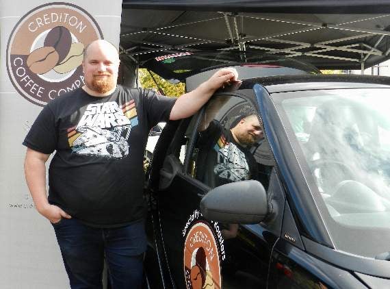 Cars and Coffee show organiser, Dan Webb, by the Crediton Coffee Company stand. NP 091021 05