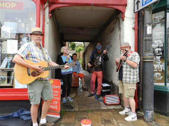The Wee Free Men (Beth Robson, Jack Robson, John Downes, Tom Blaen, Rob Rickey and Leslie Hampson beside Once Read Once Loved in Crediton.
