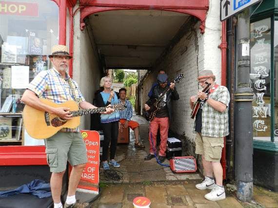 The Wee Free Men (Beth Robson, Jack Robson, John Downes, Tom Blaen, Rob Rickey and Leslie Hampson beside Once Read Once Loved in Crediton.