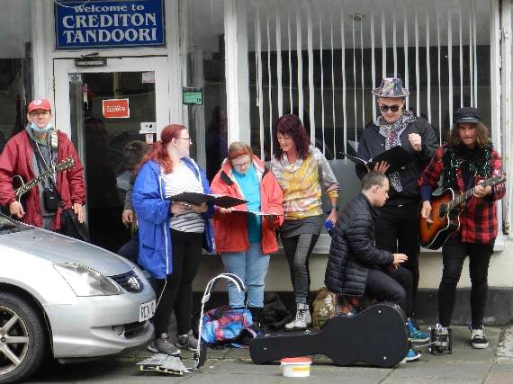 Members of The Turning Tides Project performed on Crediton High Street during Busk It! NP 210821 09