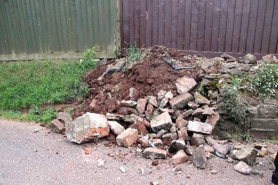 The wall which the vehicle is believed to have hit. AQ 3801
