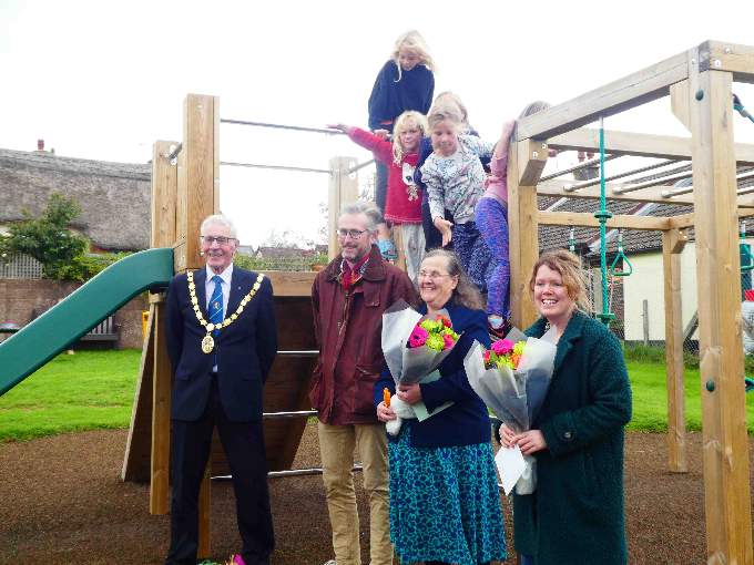 The Chairman of Mid Devon District Council, Cllr Ray Radford, Dr Charles Sheldrick (Chair of Parish Council), with Margaret Squires and Heather Sandover who helped with the fundraising and grant applications.