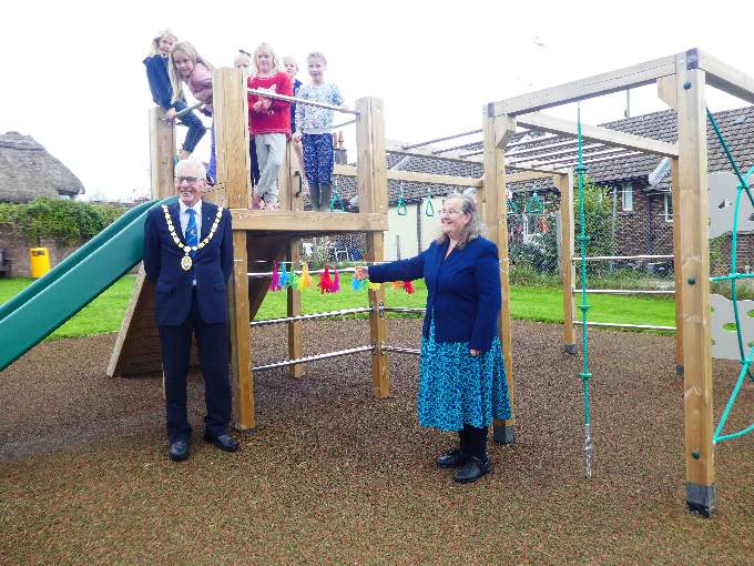 Ray Radford, Chair of Mid-Devon Council and Margaret Squires, County Councillor cutting the ribbon.