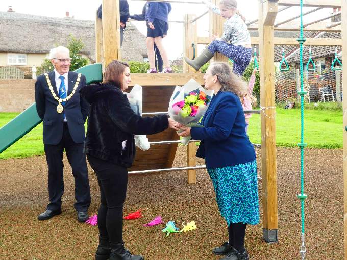 Cllr Holly Kingdon presents a bouquet to Margaret Squires.