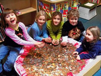Pupils cash up to save the children