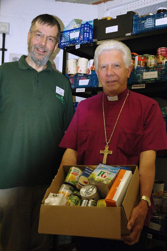 Bob Skinner, a volunteer Foodbank helper and The Right Reverend Ian Brackley who has just retired as Bishop of Dorking.