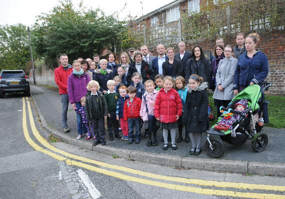 Parents and children at the Tanners Lane junction where last week’s accident occurred